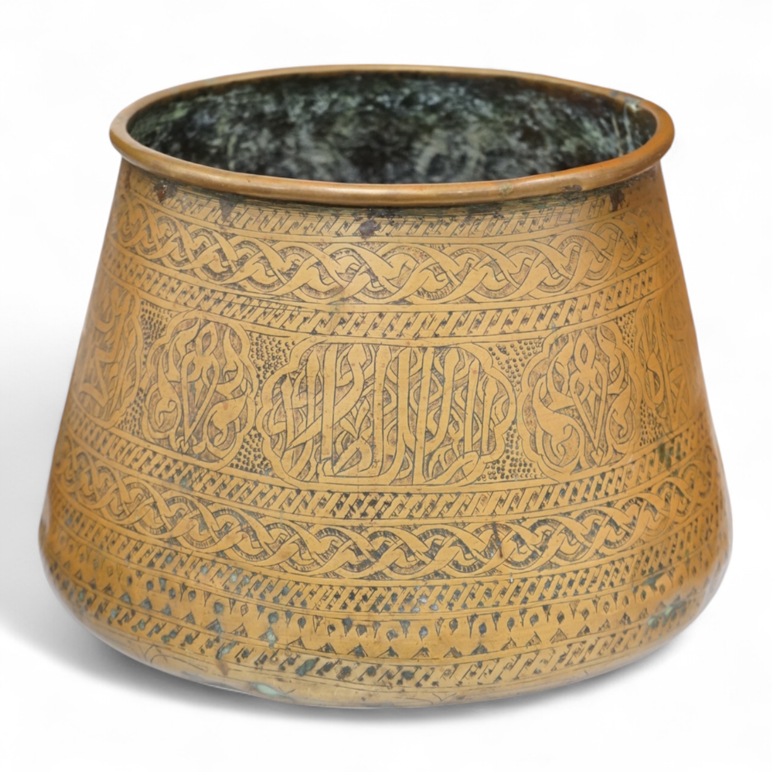 A Syrian Islamic copper vessel with detailed surface engraved pattern, 19cm high